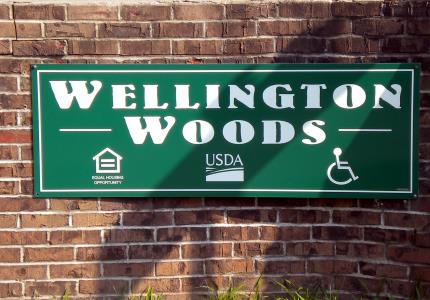 Wellington Woods sign